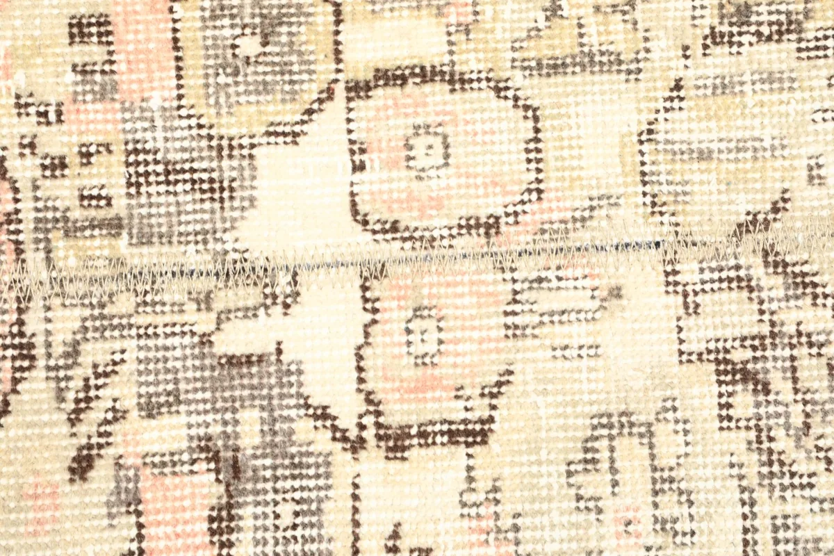 Detailed close-up of the hand-knotted wool pile, showing texture and subtle color variations