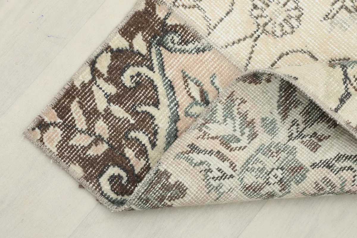 Folded corner of the runner showing the back and front of the patchwork design