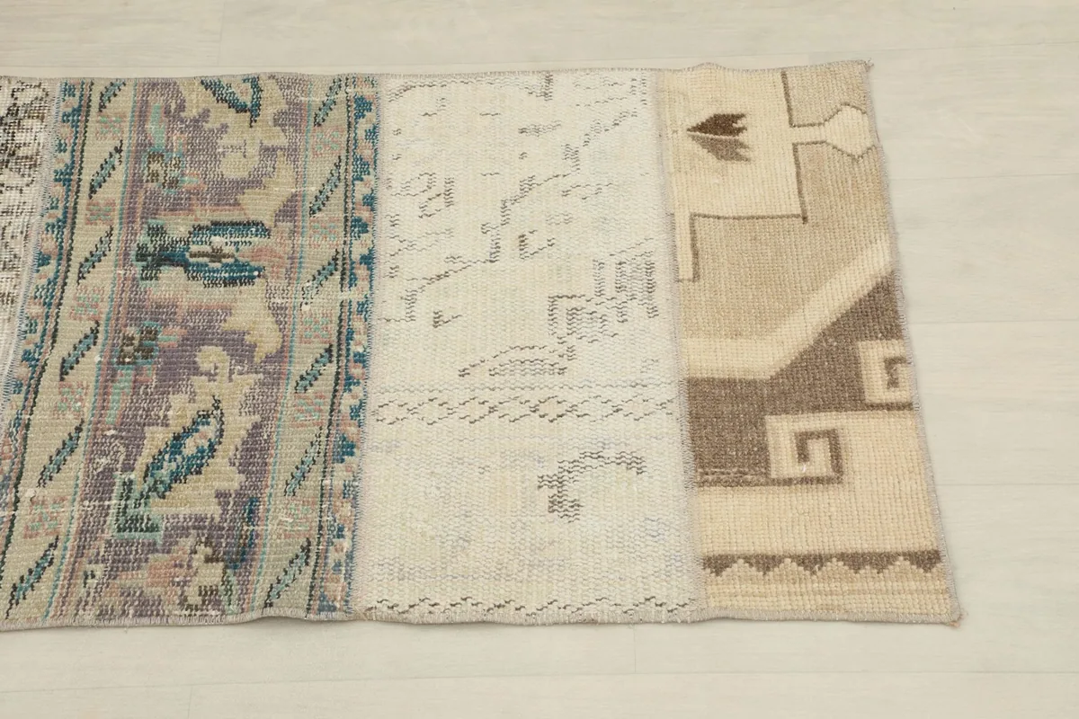 Close-up of three distinct patches on the runner, showing purple, beige, and tan geometric patterns.