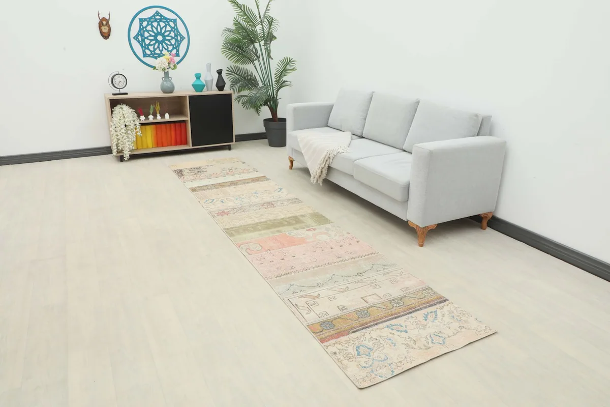 Long view of the multicolor patchwork runner rug extending through a modern living space