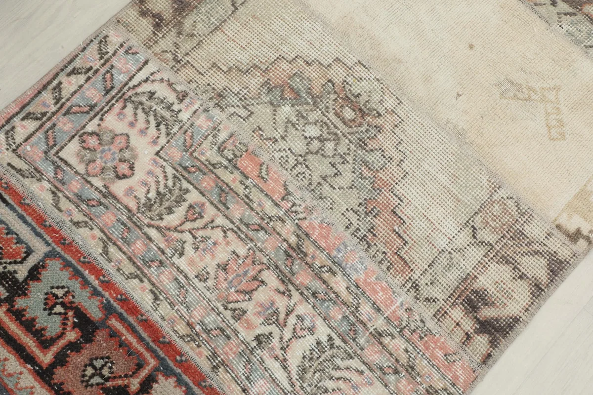 Detailed view of varied patterns and textures within the patchwork design, including a floral-like motif