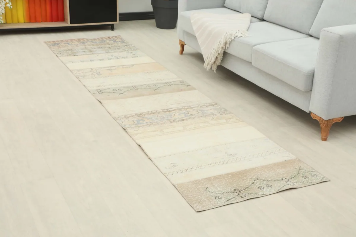Long view of the ivory and gray runner rug extending through a modern living space