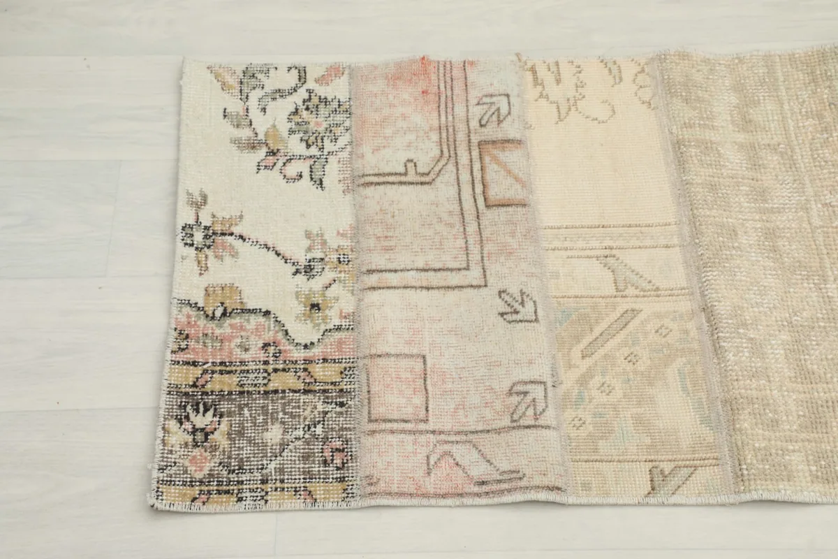 Close-up of various patchwork sections, highlighting different patterns and textures in beige and rose tones.