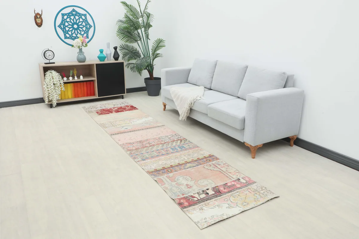 Faded Patchwork Geometric Runner in a modern living space, extending from a couch