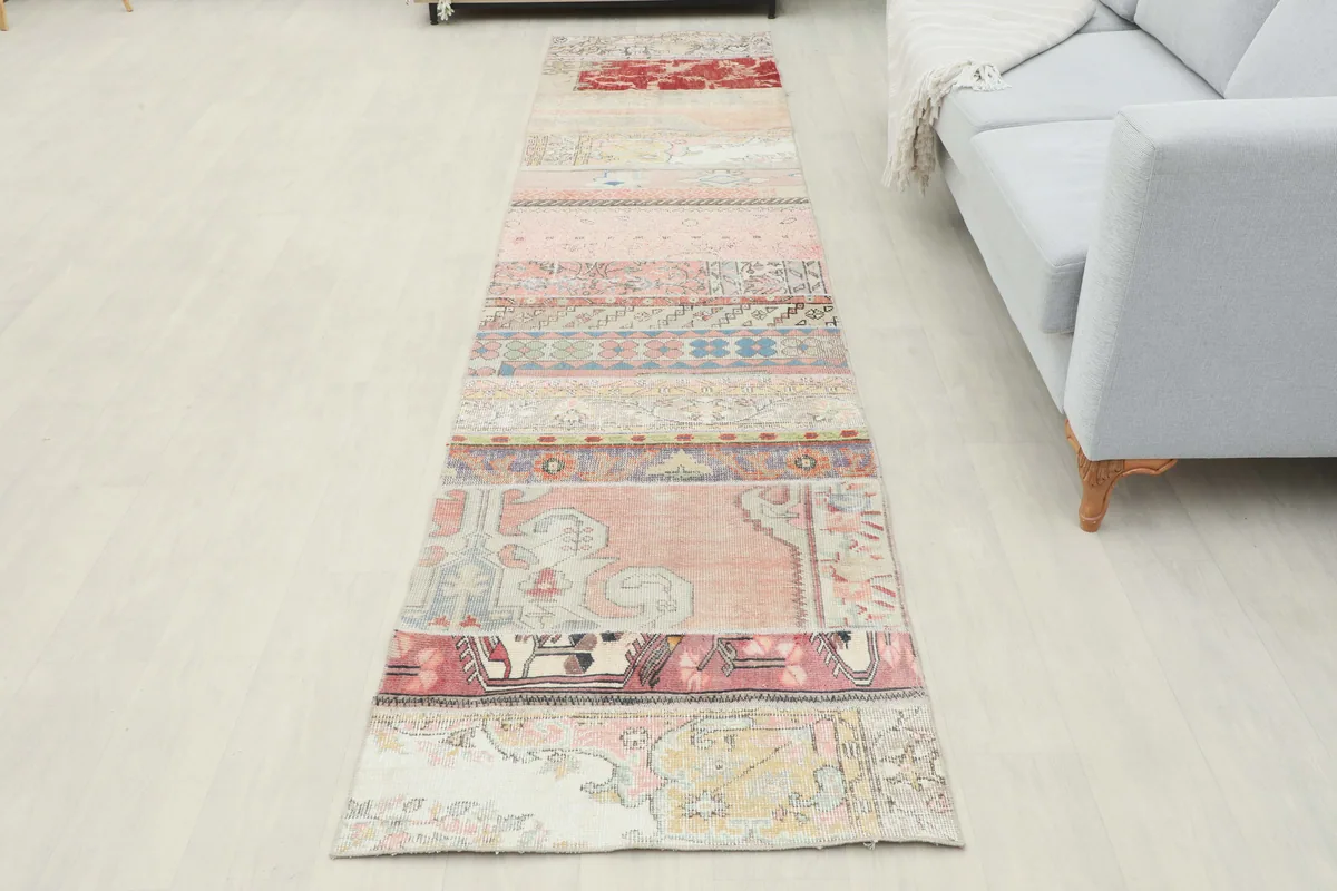 Full length view of the Faded Patchwork Geometric Runner from an elevated angle