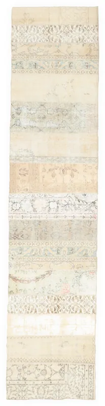 Full top view of the 2'7" x 11'7" vintage Anatolian patchwork runner rug on a white background