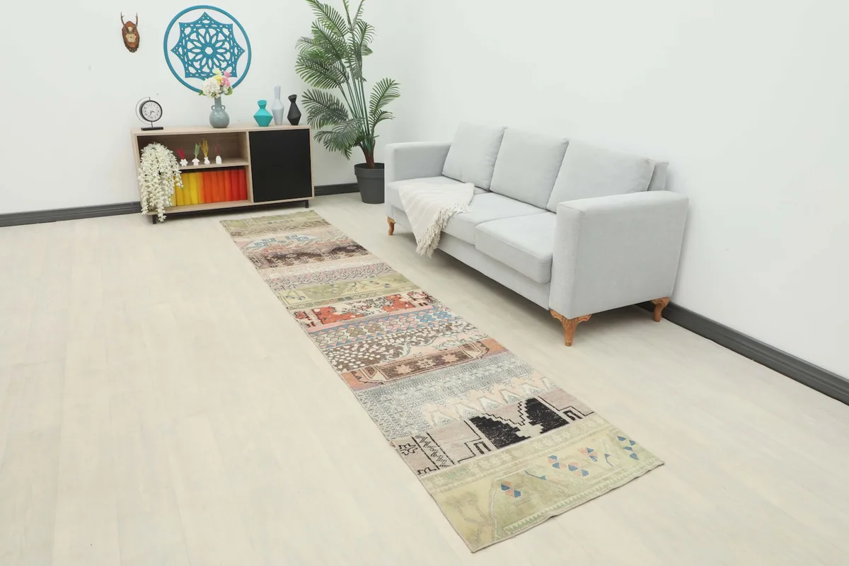 Multicolor patchwork runner rug in a modern living space with a light gray sofa