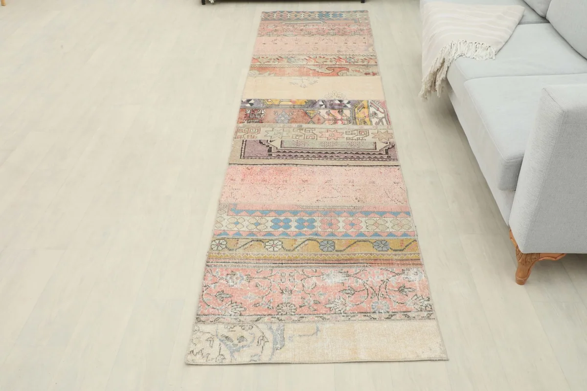 Full room view of the patchwork runner rug, providing context for its size and style in a home environment