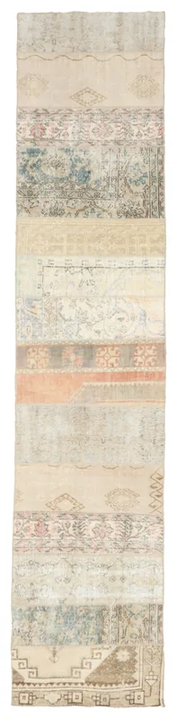 Full overhead view of the beige and blue patchwork runner rug