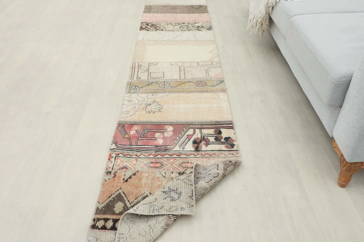 Angled view of the runner rug with one end slightly curled, showcasing its full length.