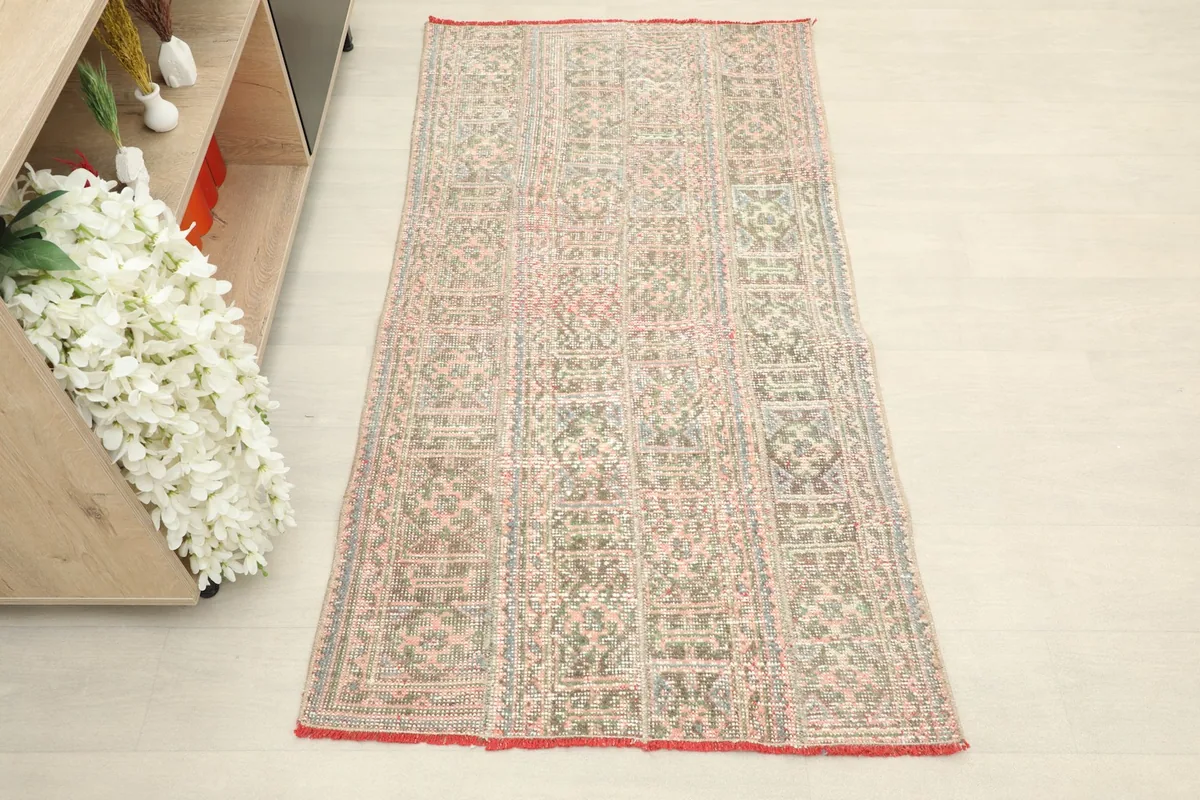 Overhead view showcasing the full length and width of the rug on a light floor.