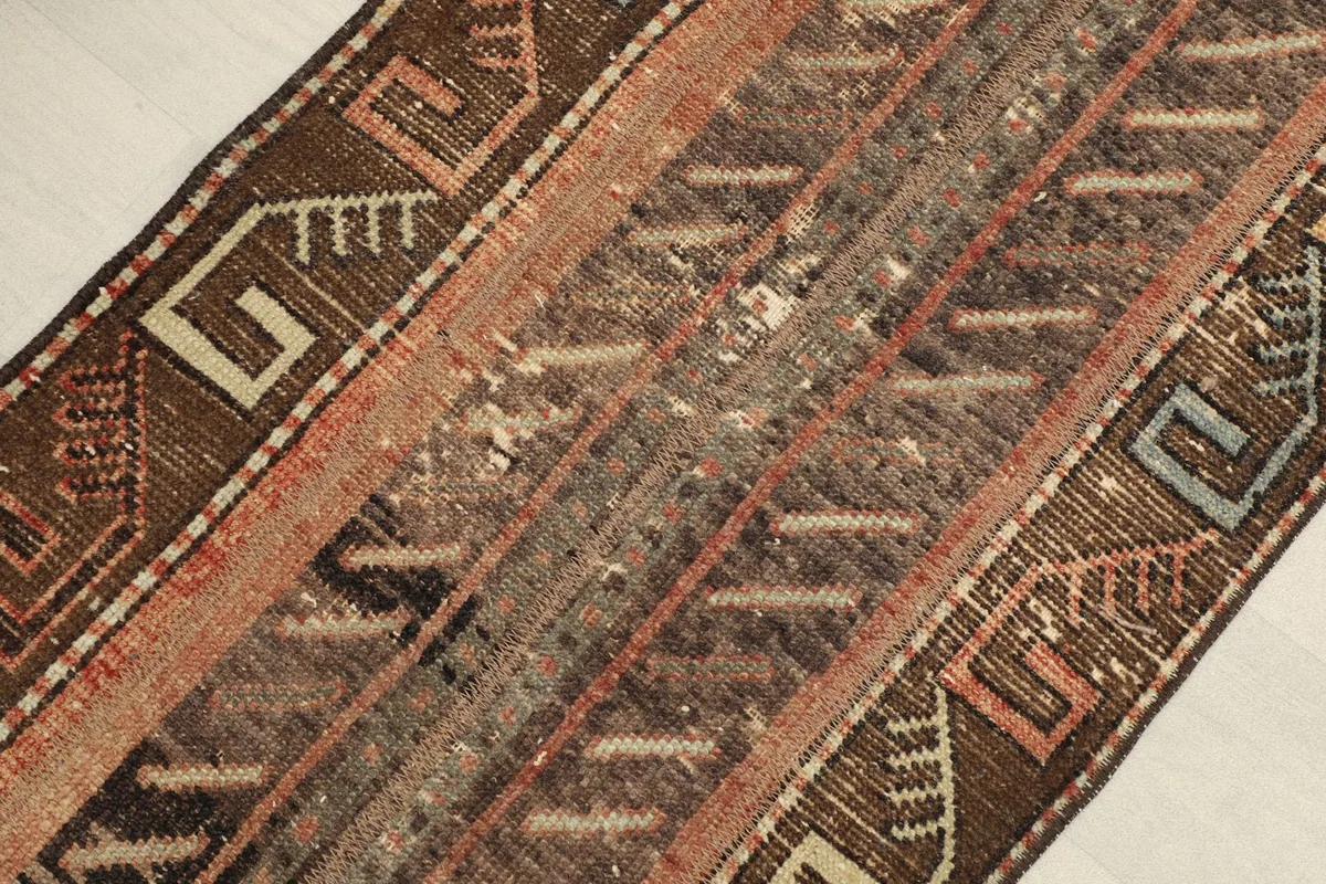 Detailed view of the central striped patterns and varying pile height.