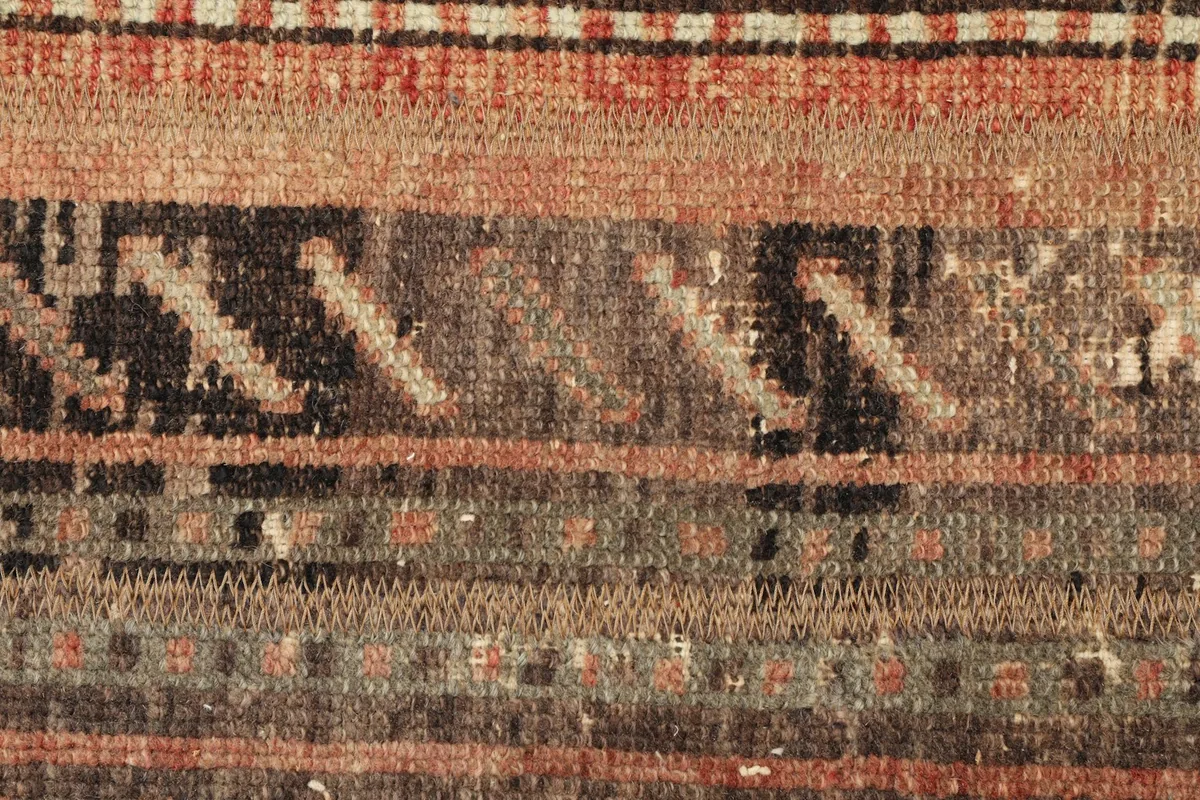Close-up of the low wool pile and intricate hand-knotted weave.