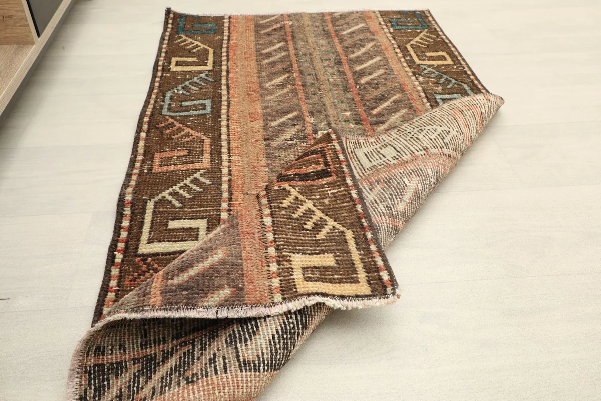The rug folded back to show the construction and a full view from an angle.