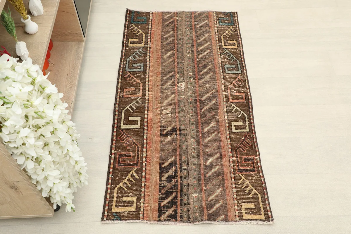 Overhead view of the hand-knotted Anatolian rug, highlighting its striped geometric design.