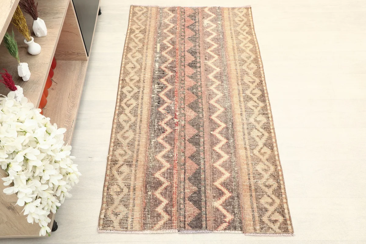 Overhead shot of the vintage Anatolian rug, highlighting its striped geometric patterns.