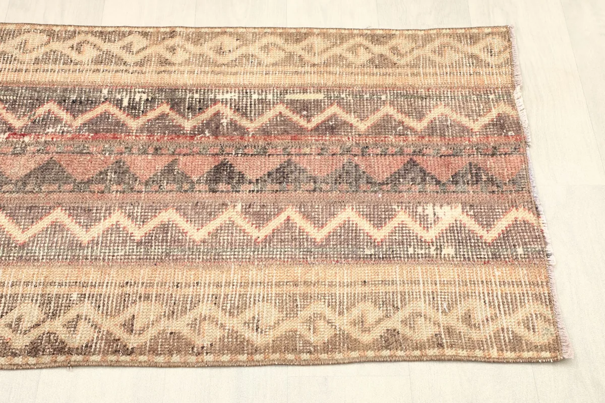 Another angled shot of the rug, emphasizing the overall design and color distribution.