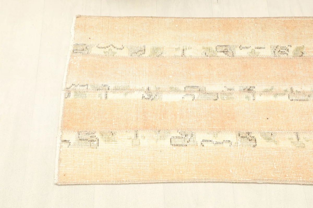 Overhead view of one end of the rug, showcasing the design and fringe