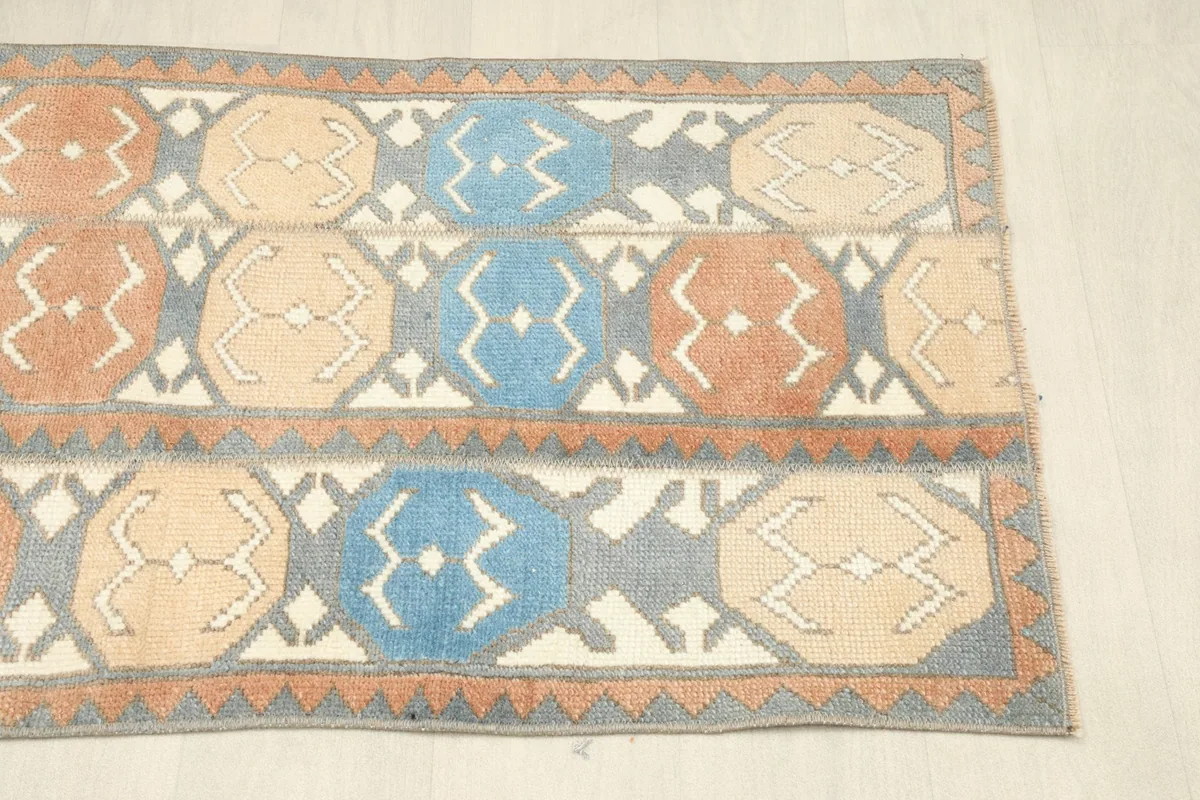 Angled view showing the right side of the vintage hand-knotted rug