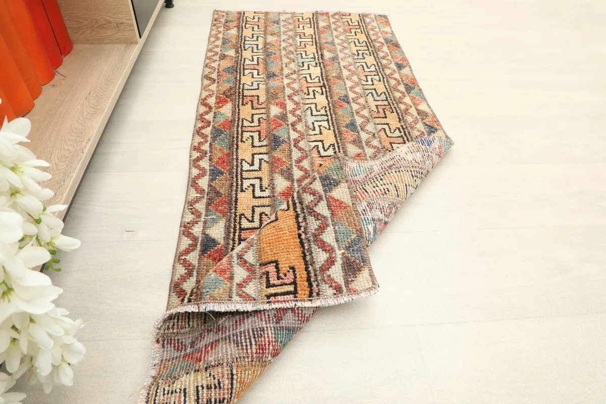 Runner partially folded to illustrate its flexibility and thickness, displaying the full design.