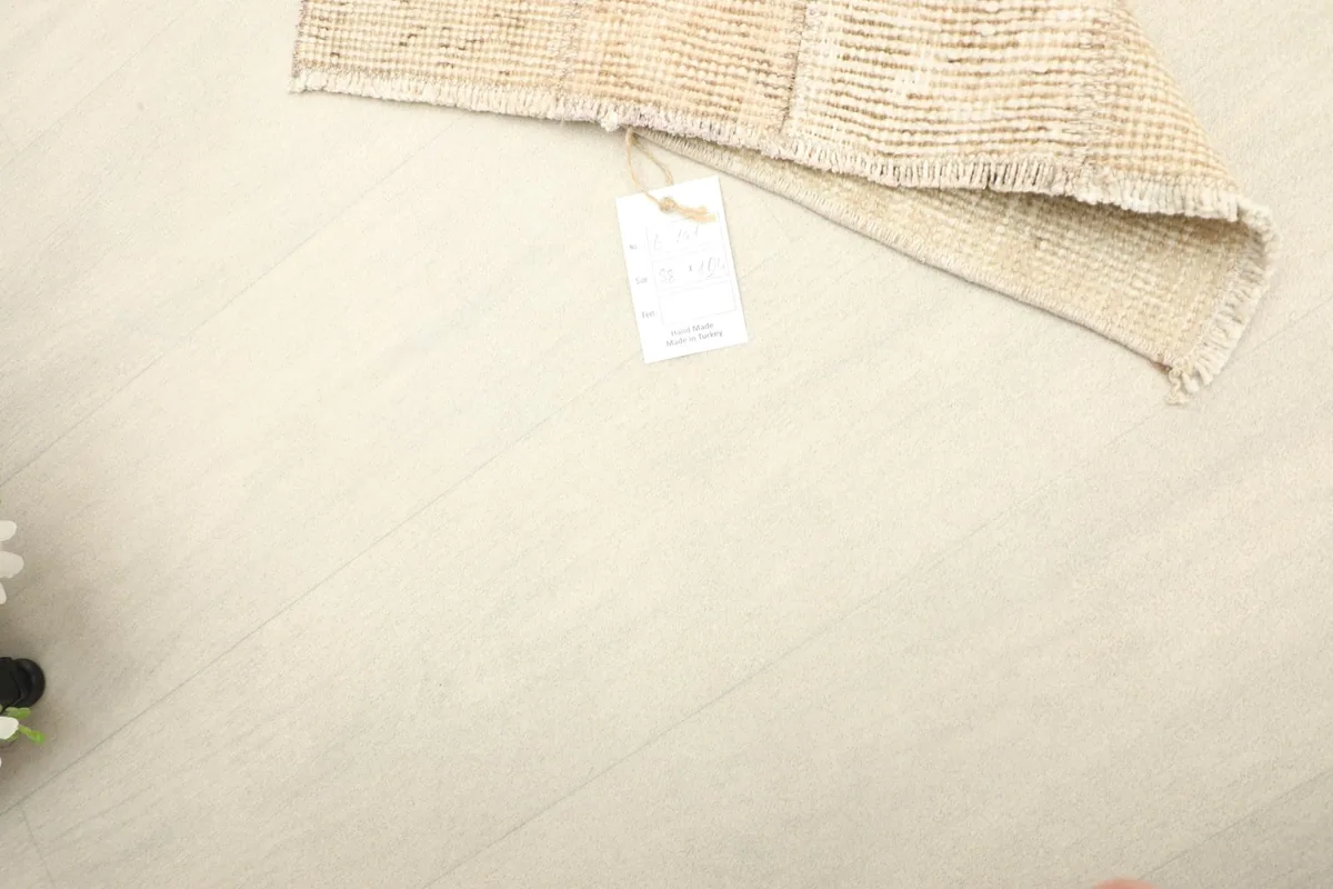 A tag attached to the rug, indicating its authenticity and origin.