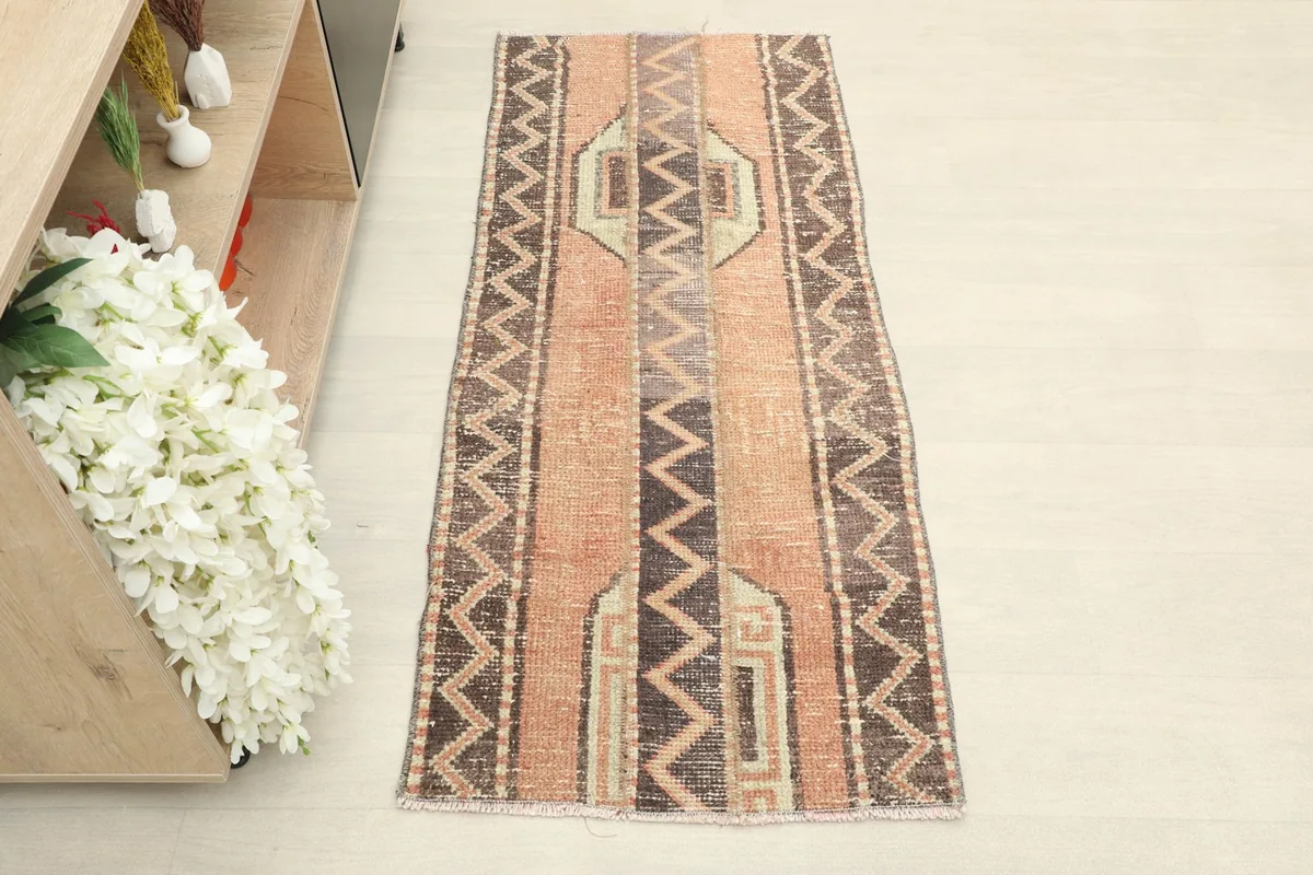 Straight overhead view of the hand-knotted wool runner, showing its full length and pattern.