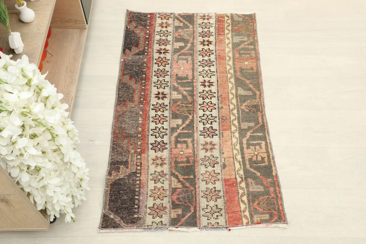 Overhead view showing the full pattern and colors of the hand-knotted wool rug.