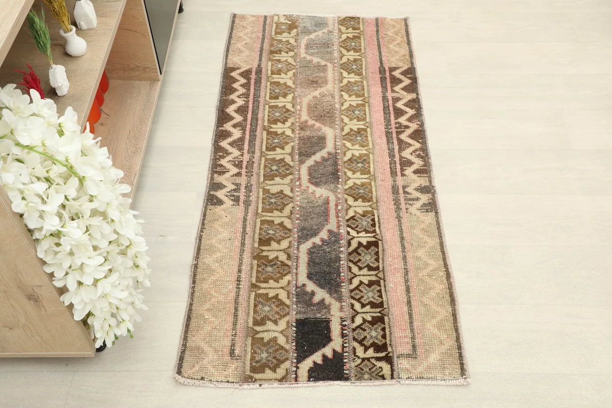 Overhead view of the vintage Anatolian patchwork rug, showing its full length