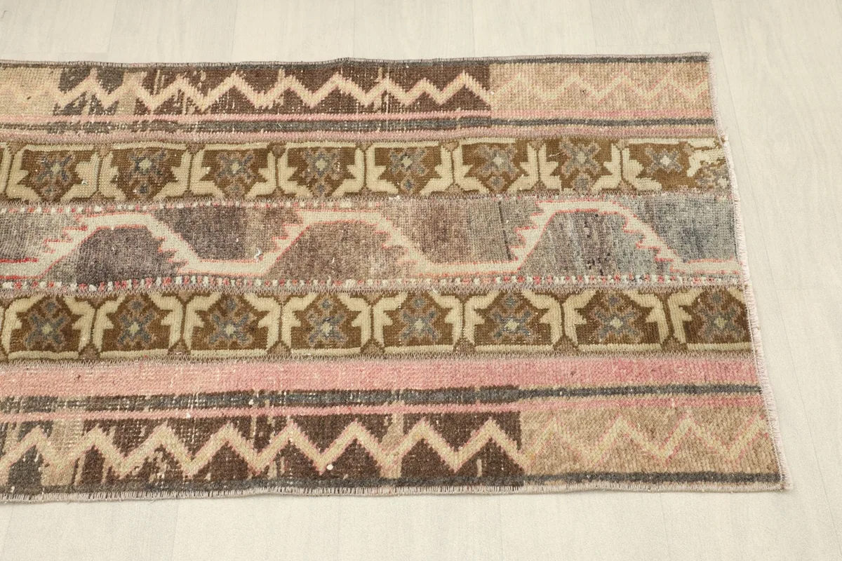 Overhead view of the other end of the rug, showing the continuation of the patchwork design