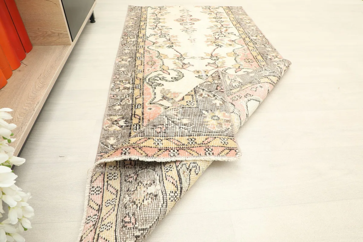 The runner partially folded, giving a sense of its texture and the overall design flow.