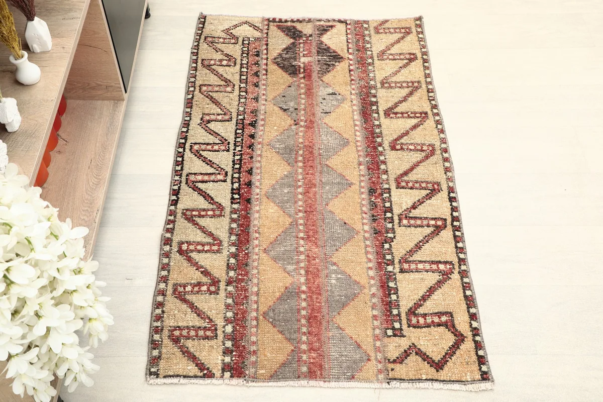 Overhead view showcasing the full pattern and colors of the vintage wool rug.