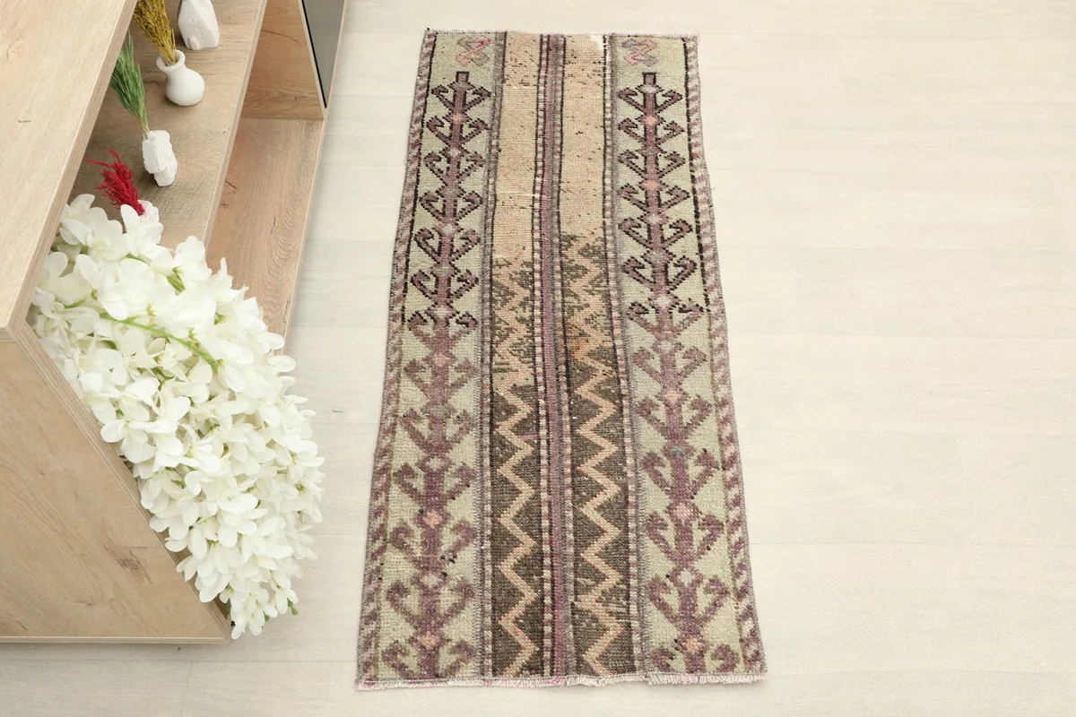 Overhead view showing the complete design and color variations of the hand-knotted rug.