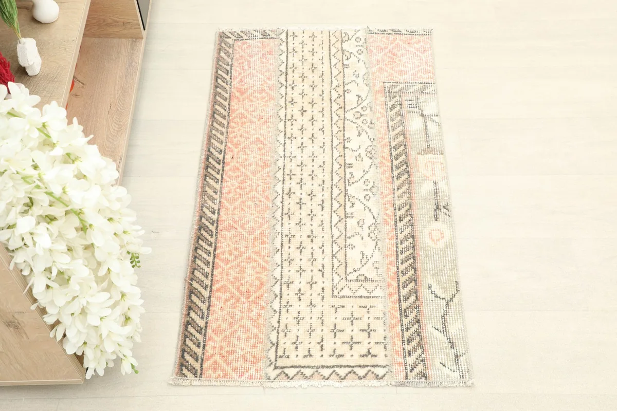 Overhead shot of the vintage Anatolian rug, highlighting its balanced patchwork design and colors.
