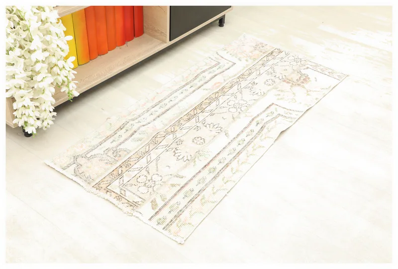 Full top view of the ivory floral patchwork rug on a white background, showcasing its overall design.