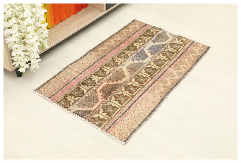 Full top view of the 2'0" x 3'4" Rose Brown Geometric Patchwork Rug on a white background.
