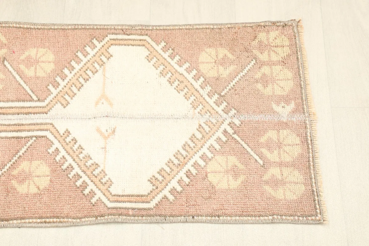 Overhead view showing the other end of the rug, detailing the border and field patterns.