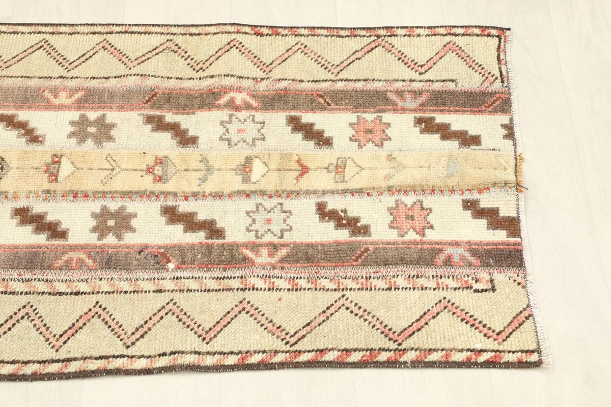 Overhead shot of the other end of the rug, displaying the consistency of the geometric and striped design.