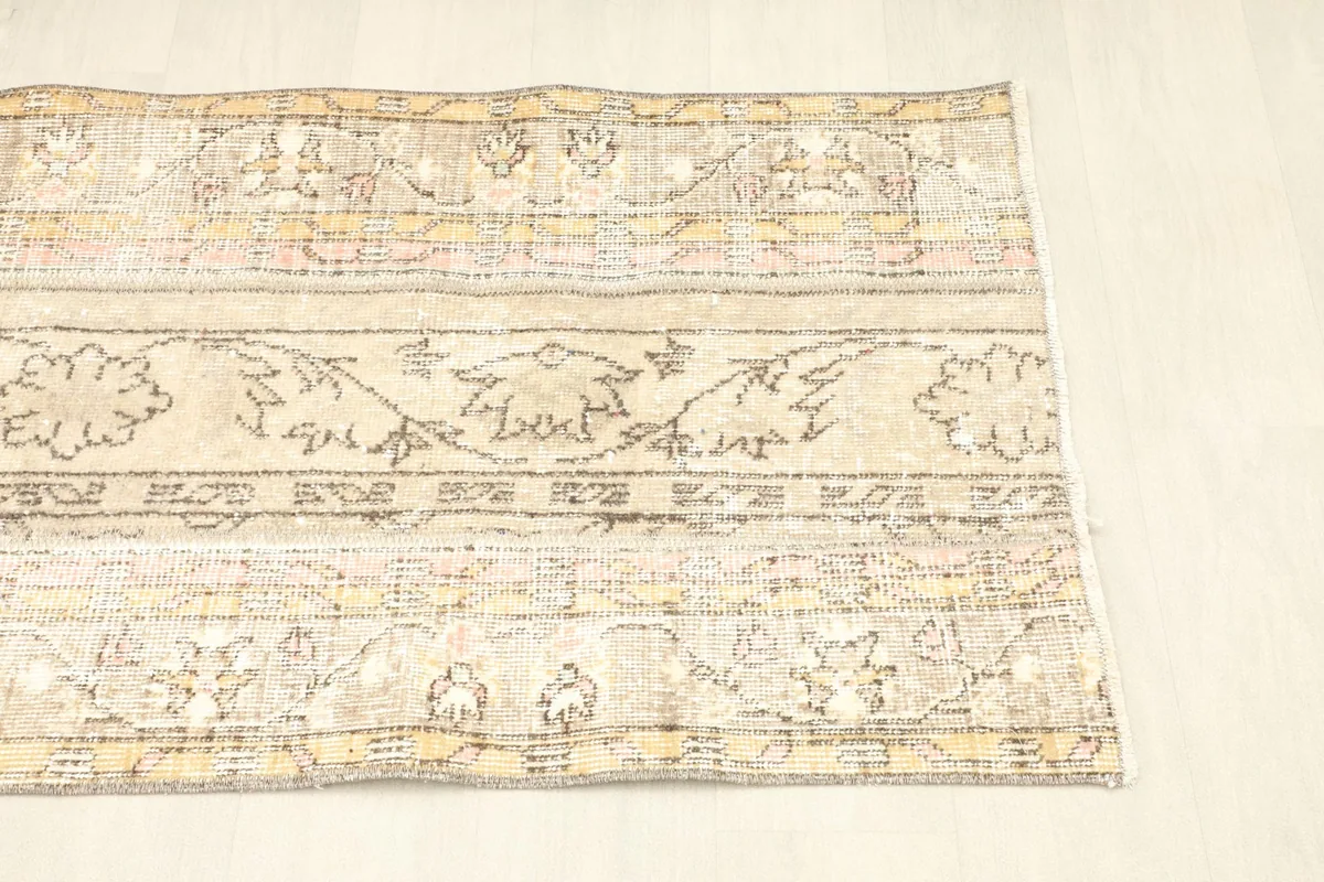 Angled view of the rug's right side, emphasizing the balanced composition of its panels.