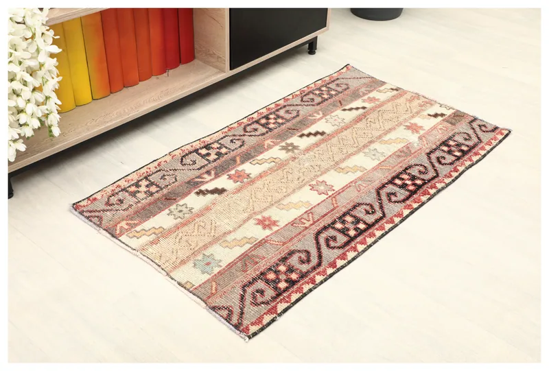 Full top view of the beige and gray striped vintage Anatolian rug