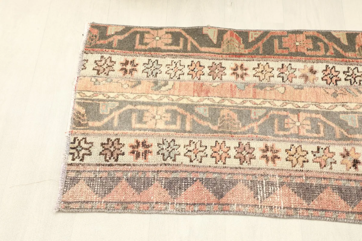 Overhead view of one end of the runner, focusing on the striped and triangular border design