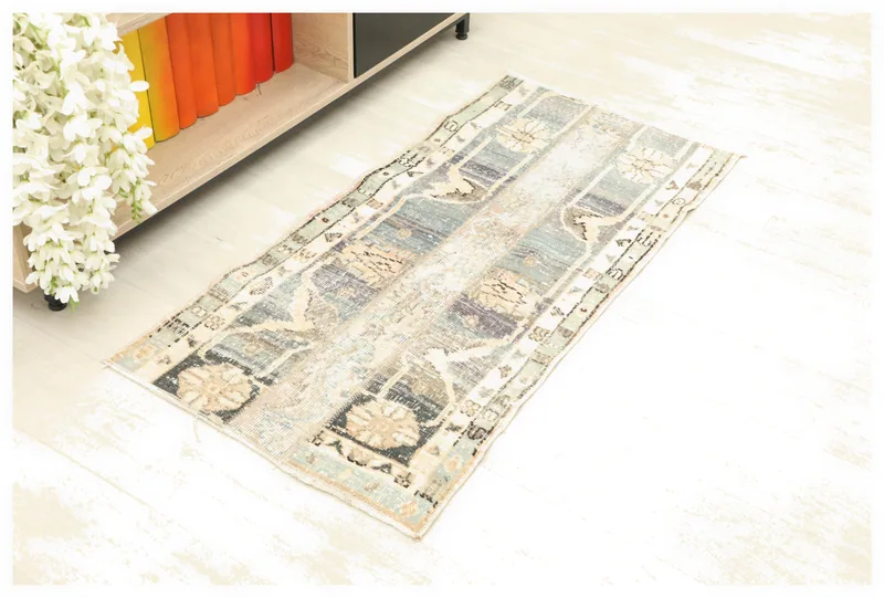 Full top view of the 2x4 blue gray patchwork vintage Anatolian rug on a white background.