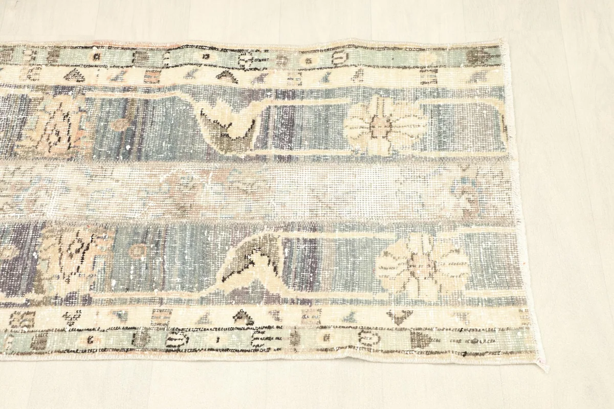 Another overhead perspective of the rug, showing the full length and varied blue and cream tones.