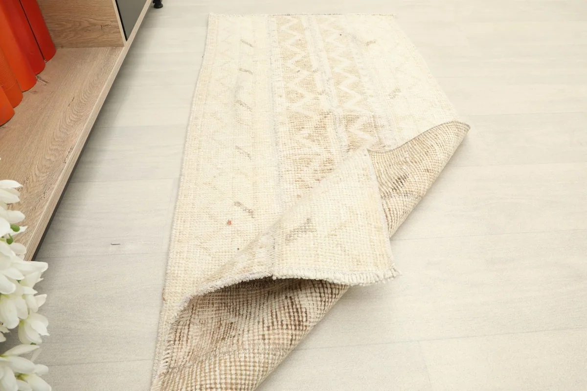 The rug folded to reveal both the pile and the reverse side, showing its flexibility.