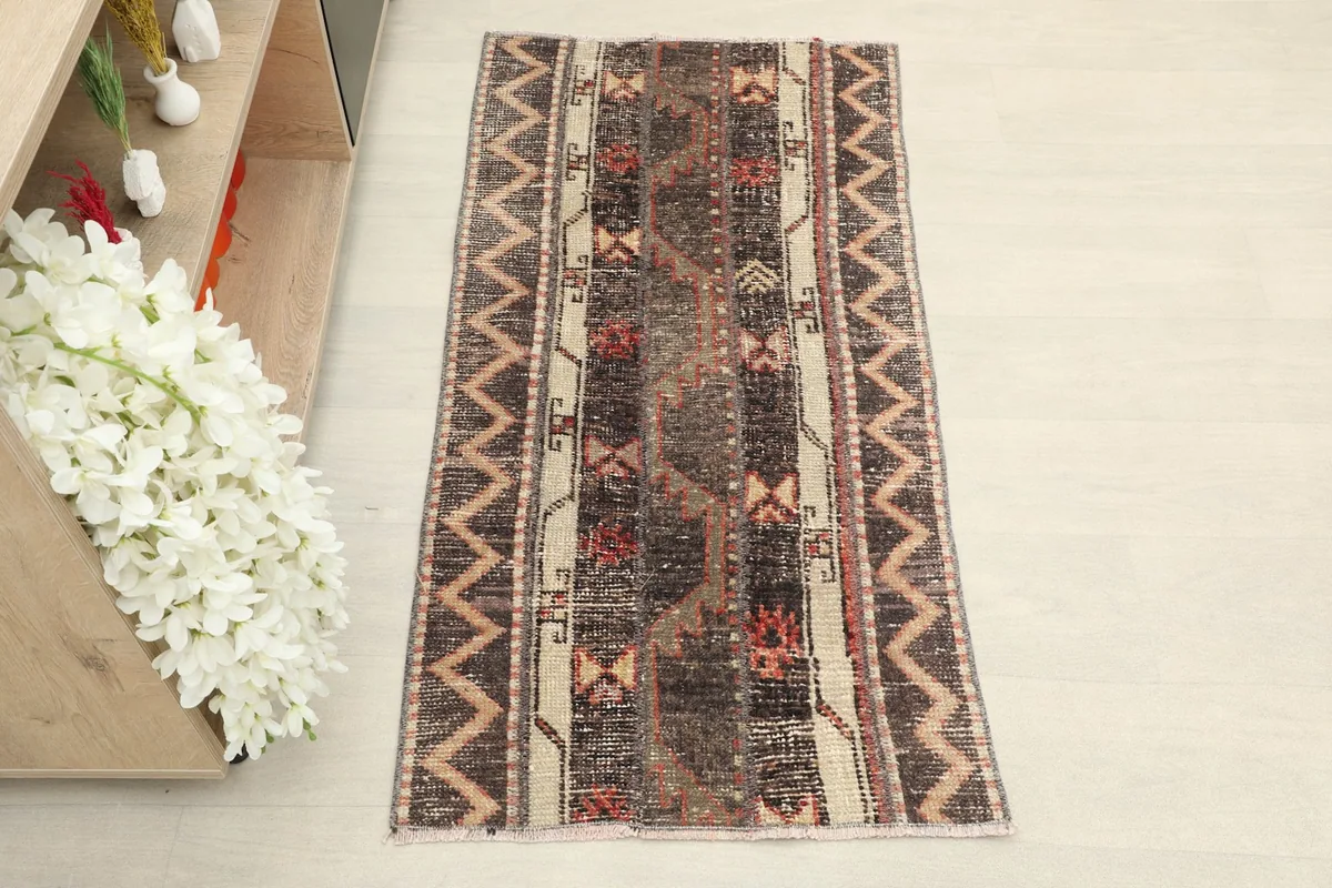 Overhead view of the hand-knotted wool rug, showcasing its full design and colors