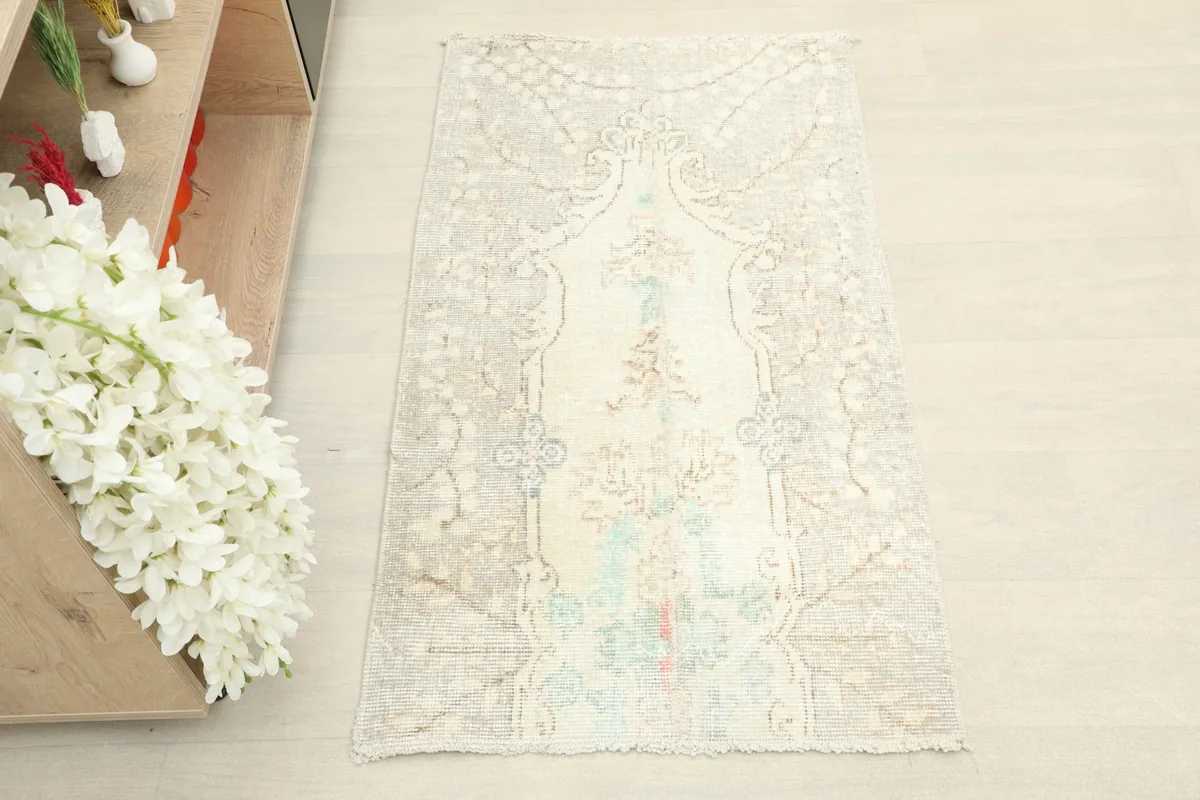 Overhead view showcasing the full design of the vintage ivory rug.