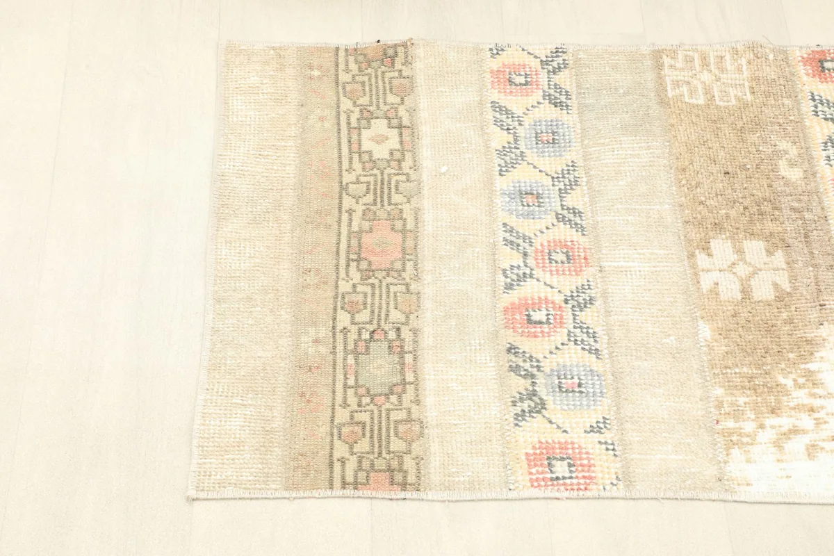 Angled view from one side of the rug, showing the striped design and colors.