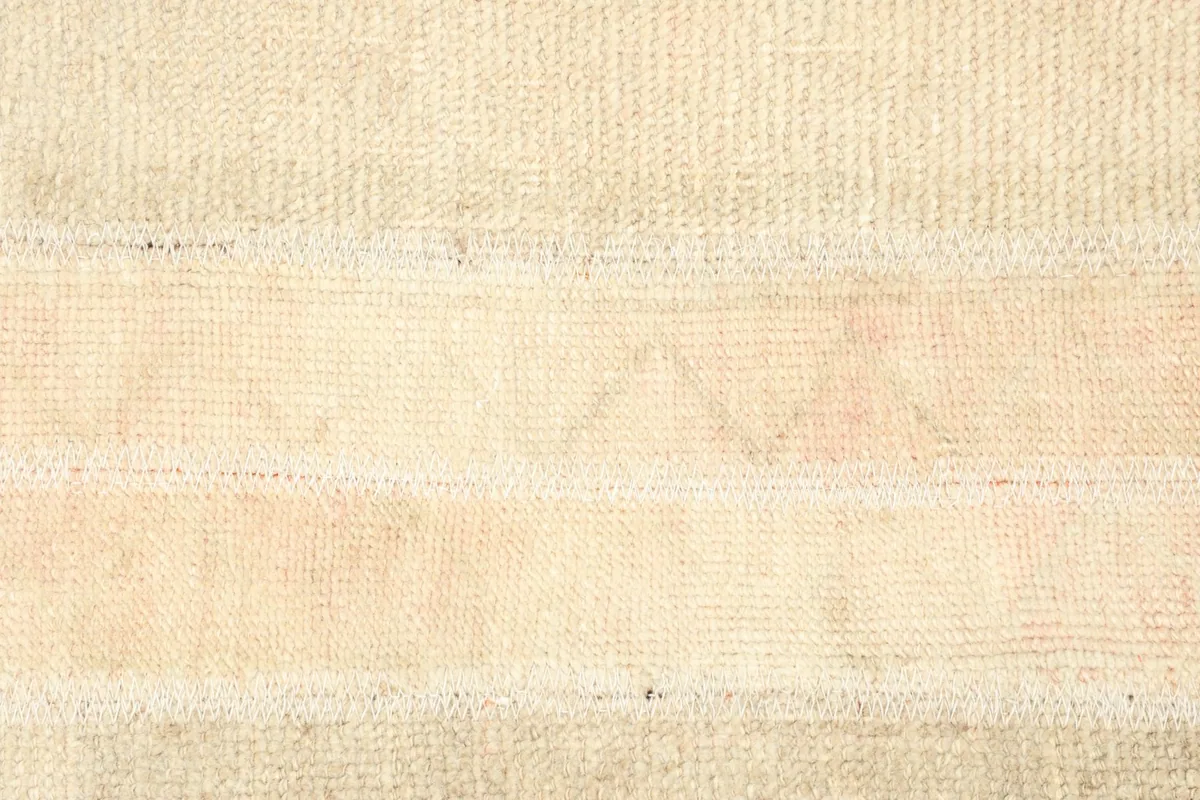 Detailed view of the central section, revealing subtle geometric motifs within the bands of color.