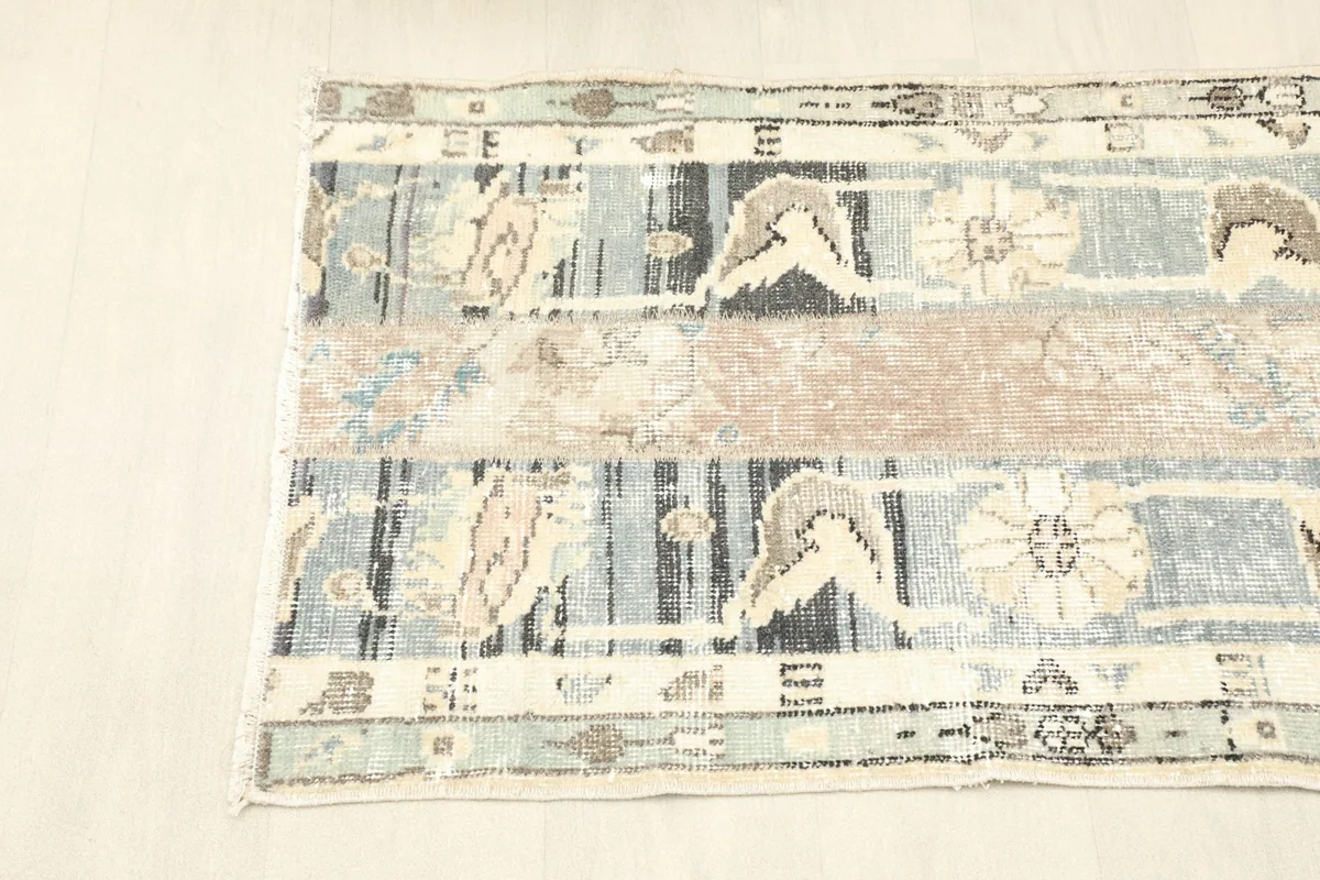 View from the opposite end of the rug, showing the consistent patchwork design and color scheme.