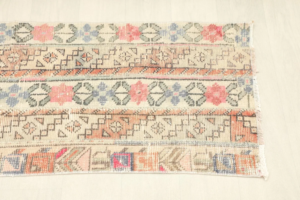 Angled view of the runner's bottom half, revealing the varied patterns and color palette.