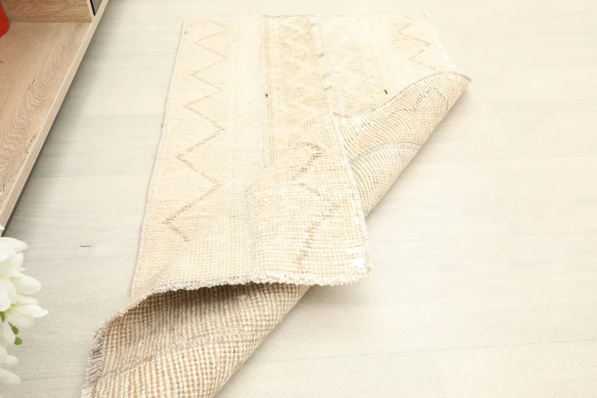 The rug partially folded, demonstrating its flexibility and thickness.
